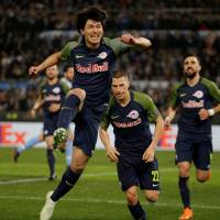 Salzburg\'s Takumi Minamino celebrates after scoring a goal against Lazio in a Europa League match on Thursday in Rome. | REUTERS