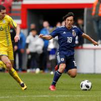 Shoya Nakajima controls the ball during Japan\'s 2-1 friendly defeat to Ukraine in Liege, Belgium, on March 27. | REUTERS