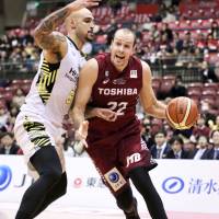 Kawasaki Brave Thunders center Nick Fazekas attacks the basket against the Sunrockers Shibuya in September at Todoroki Arena. The former NBA player has obtained Japanese citizenship. | KAZ NAGATSUKA
