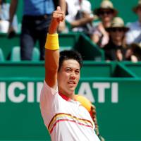 Kei Nishikori celebrates after his victory over Daniil Medvedev in the second round of the Monte Carlo Masters on Wednesday. | REUTERS