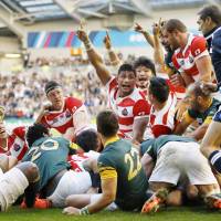 Japan\'s players appeal to the referee during their 34-32 win over South Africa at the 2015 Rugby World Cup in Brighton, England. | KYODO