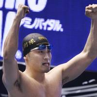 Kengo Ida celebrates his victory in the men\'s 50-meter butterfly at the Japan Swimming Championships on Wednesday. Ida had a national record time of 23.40 seconds to capture his first national title. | KYODO