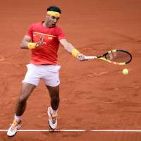 Rafael Nadal plays a shot from Germany\'s Philipp Kohlschreiber in their Davis Cup quarterfinal match in Valencia, Spain, on Friday. | AFP-JIJI