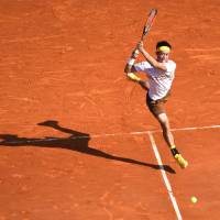 Kei Nishikori plays a shot from Croatia\'s Marin Cilic in their quarterfinal match at the Monte Carlo Masters on Friday. | AFP-JIJI