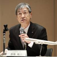 Japan Airlines Co. President Yuji Akasaka talks about plans for a budget carrier during a news conference in Tokyo on Monday. | KYODO