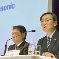 Panasonic Corp. CEO Kazuhiro Tsuga, right, attends a news conference on Thursday in Tokyo. | KYODO