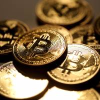 More than 300 cryptocurrency traders reported over &#165;100 million in miscellaneous income on their tax returns for 2017, National Tax Agency data show. | BLOOMBERG