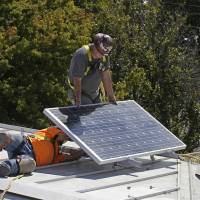 A solar panel is installed on the roof of the Old Governor\'s Mansion State Historic Park in Sacramento, California, on Oct. 16, 2015. | AP