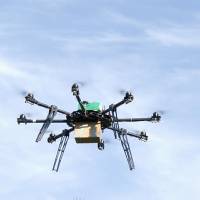 A drone carrying a package of medicine takes flight in Myagdi, Nepal, on April 9. | KAMAL PUN