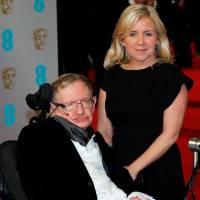 Theoretical physicist Stephen Hawking and his daughter, Lucy, arrive at the British Academy of Film and Arts awards ceremony at the Royal Opera House in London in February 2015. | REUTERS