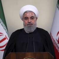 Iranian President Hassan Rouhani addresses the nation by television from Tehran on Tuesday. | AP
