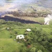 In this Sunday frame from video released by the U.S. Geological Survey, gases rise from a fissure near Pahoa, Hawaii. | U.S. GEOLOGICAL SURVEY / VIA AP