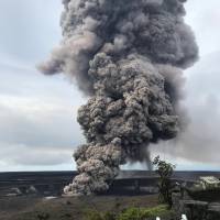 Ash rises from Mount Kilauea on Wednesday. | REUTERS