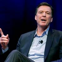 Former FBI director James Comey speaks about his book during an onstage interview with Axios Executive Editor Mike Allen at George Washington University in Washington April 30. | REUTERS
