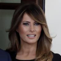 First lady Melania Trump greets French President Emmanuel Macron and his wife, Brigitte Macron, at the White House in Washington April 23. The White House says Melania Trump will announce her initiatives as first lady on Monday. The first lady\'s spokeswoman, Stephanie Grisham, says the focus will be on the overall well-being of children. | AP