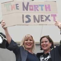 Sinn Fein leader Mary Lou McDonald and Michelle O\'Neill, the leader of Sinn Fein in Northern Ireland, celebrate the result of the Irish referendum on liberalizing abortion law in Dublin on Saturday. | REUTERS
