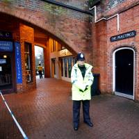 A police officer stands on duty outside a pub that has been secured as part of the investigation into the poisoning of former Russian intelligence agent Sergei Skripal and his daughter, Yulia, in Salisbury, Britain, March 12. | REUTERS