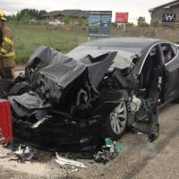 This Tesla Model S, shown on May 11, accelerated while in Autopilot mode before it smashed into a stopped firetruck in South Jordan, Utah, according to police. Two people were injured. | AP