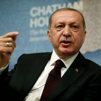Turkish President Recep Tayyip Erdogan speaks at Chatham House in central London on May 14. | REUTERS