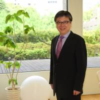 Tomoyoshi Noda, who is opening a business school in Tokyo in August, poses for a photo April 25. | SATOKO KAWASAKI