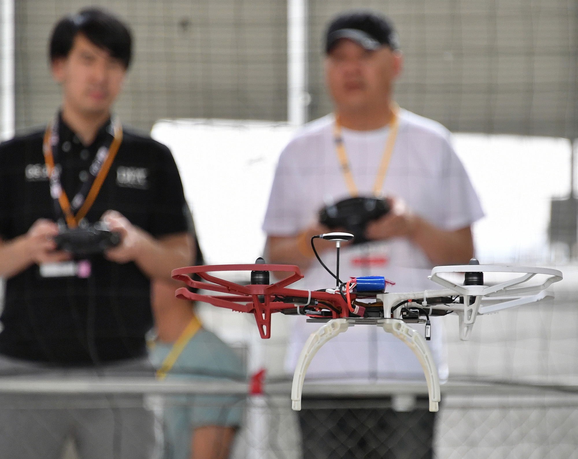 A student practices flying a drone at a school in Tokyo's Koto Ward on May 15. | YOSHIAKI MIURA