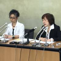 Chie Matsumoto (left) and Yoshiko Hayashi, both freelance journalists, speak at a news conference in Tokyo on Tuesday. | CORY BAIRD