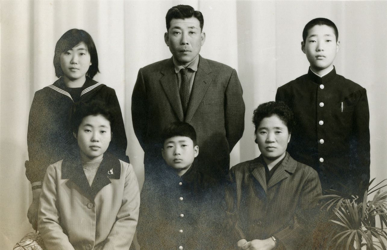 A portrait shows (clockwise from left) Kang Yeoung Suk, her father, brother, mother, and her youngest brother, and sister who moved to North Korea in the 1970s. | COURTESY OF KANG YEOUNG SUK