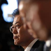 South Korea\'s President Moon Jae-in attends a trilateral summit with Prime Minister Shinzo Abe and Chinese Premier Li Keqiang at Akasaka Palace in Tokyo on Wednesday. | AP