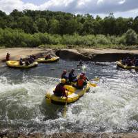Tourists take part in a rafting tour in the town of Kutchan, Hokkaido, in 2016. | BLOOMBERG