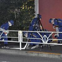 Authorities investigate the scene of a stabbing outside NHK headquarters in Tokyo\'s Shibuya Ward on May 18. | KYODO