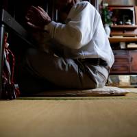 A 75-year-old man, who goes by the name Saburo Kita in the Japanese media to avoid questions from his late wife’s family, is interviewed at his home in Tokyo on April 22. | REUTERS