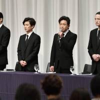 Shigeru Joshima (second from right), leader of the Japanese all-male pop group Tokio, speaks at a news conference Wednesday in Tokyo while other group members Masahiro Matsuoka, Tomoya Nagase and Taichi Kokubun look on. | KYODO