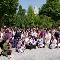 Supporters of a bill seeking to achieve 50-50 gender equality in the Diet and local assemblies pose for a photo in front of the Diet building on Wednesday following enactment of the legislation. | TOMOHIRO OSAKI