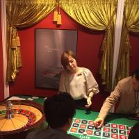 Participants take part in a demonstration at the Japan Casino School\'s Osaka branch. | ERIC JOHNSTON