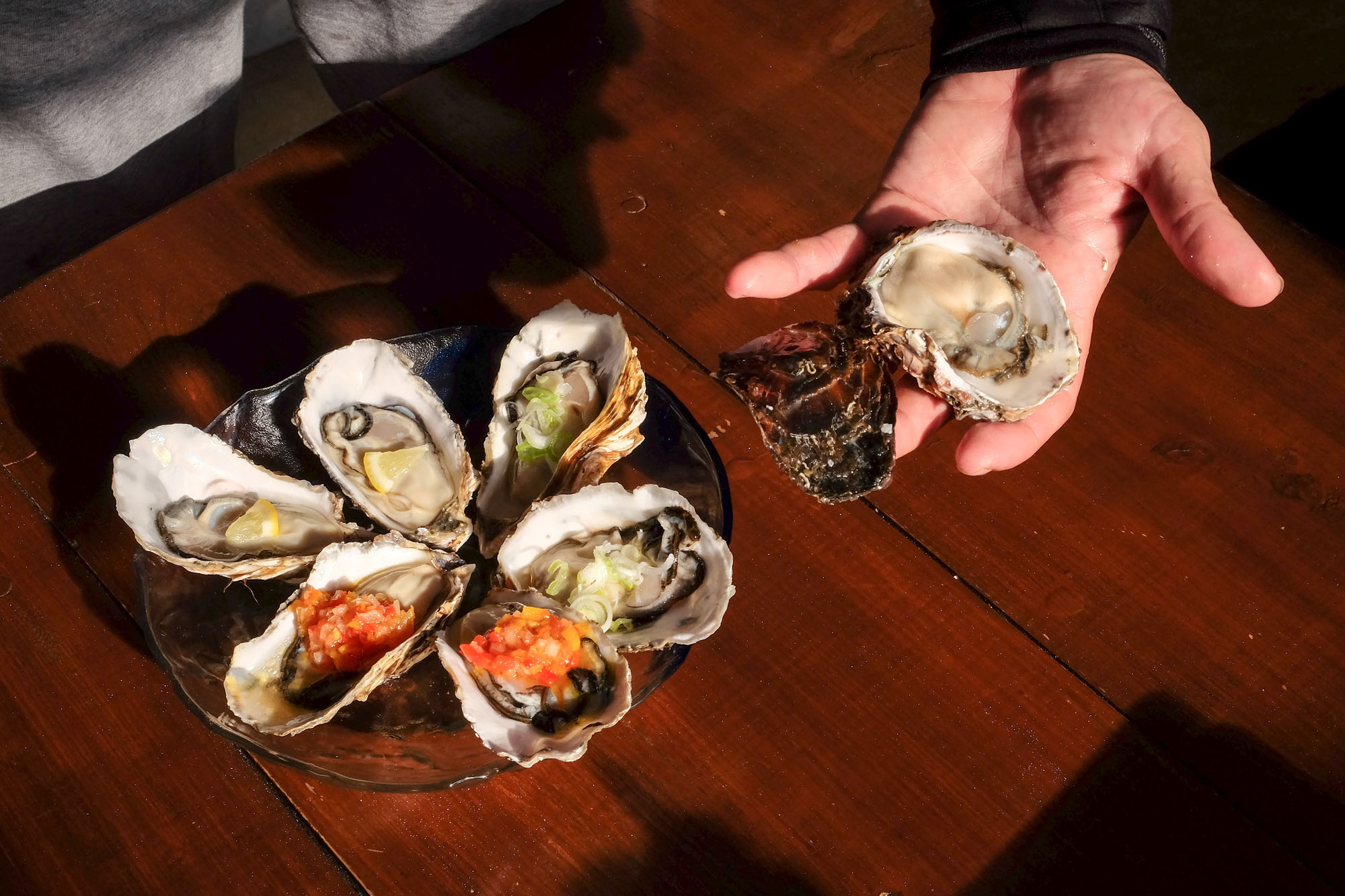 Shima Peninsula oysters topped with lemon, salsa and spring onion. | LANCE HENDERSTEIN