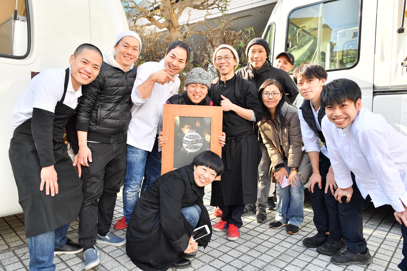 Fishing for change: Chefs for the Blue assembled at their food cart event at UNU Tokyo. Chef Shinsuke Ishii is left of center in white and founding-member Hiroko Sasaki can be seen third from right in a puffer jacket. | COURTESY OF CHEFS FOR THE BLUE