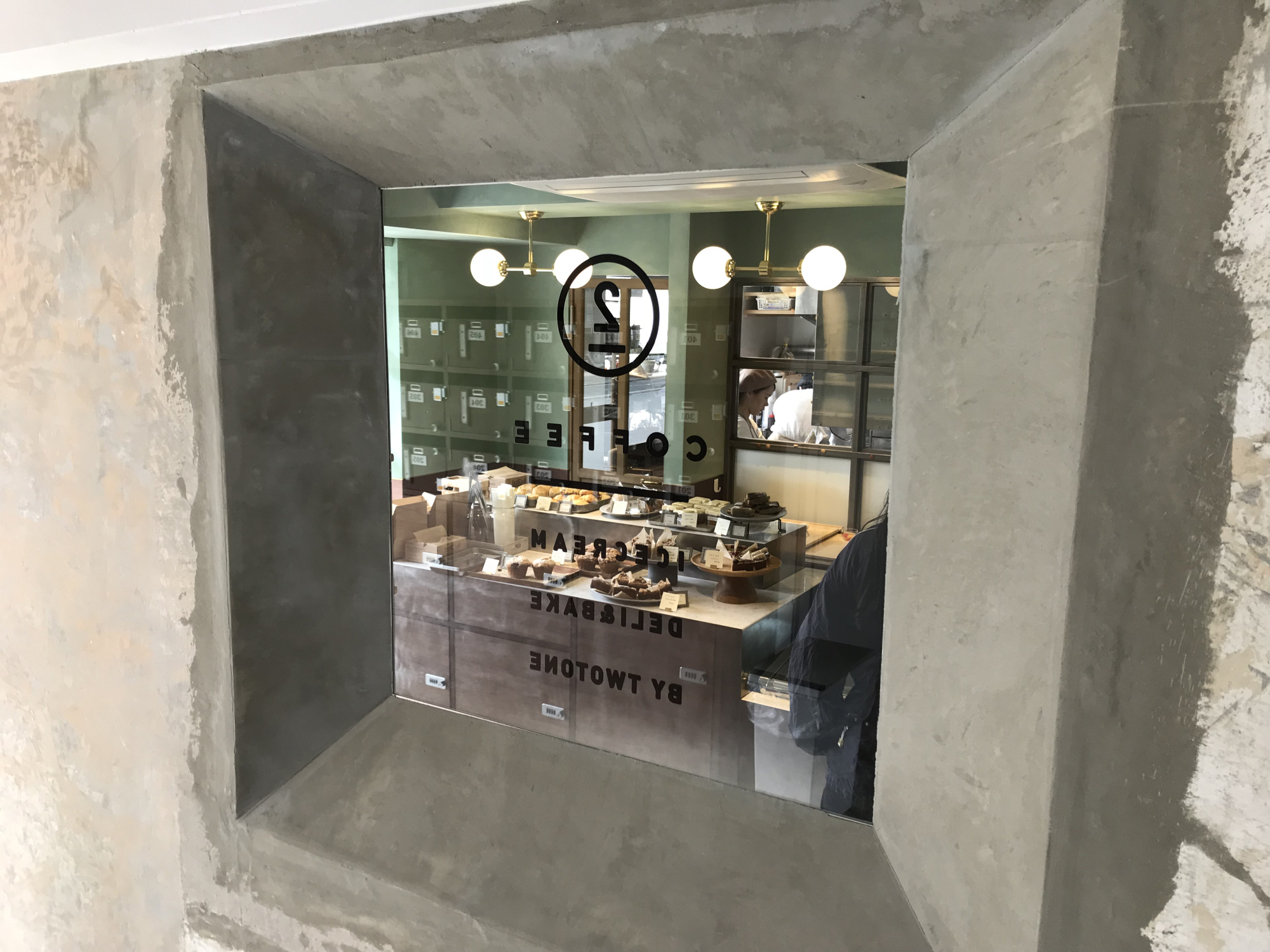 Outside in: By Twotone's chic concrete exterior hides a sparse but stylish cafe space and bakery. | J.J. O'DONOGHUE