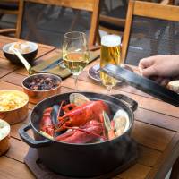 A summer beer garden menu is offered on the terrace of The Oak Door steakhouse. Both plans are available from June through September. | REUTERS