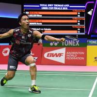 Kento Momota hits a return against Brice Leverdez of France in a men\'s singles quarterfinals match at the Thomas Cup in Bangkok on Thursday. | AFP-JIJI