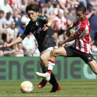 Groningen midfielder Ritsu Doan (left),  seen in action in a recent Dutch League first-division match, will complete a full transfer to the team from Gamba Osaka. | KYODO