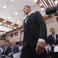 Taisuke Miyagawa, a Nihon University American football player, arrives for a news conference on Tuesday in Tokyo. | AP