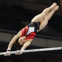 Mai Murakami participates in the women\'s all-around competition during the NHK Cup on Saturday at Tokyo Metropolitan Gymnasium. She finished first overall. | KYODO