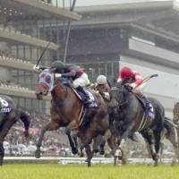 Jour Polaire (second from left) comes home to win the Victoria Mile on Sunday at Tokyo Racecourse. | KYODO