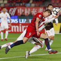 Antlers\' Yuma Suzuki (9) scores on a header during Kashima\'s victory over Shanghai in their Asian Champions League match on Wednesday in Kashima, Ibaraki Prefecture. | KYODO