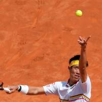 Kei Nishikori serves during his first-round match against Spain\'s Feliciano Lopez at the Italian Open in Rome on Monday. | AFP-JIJI