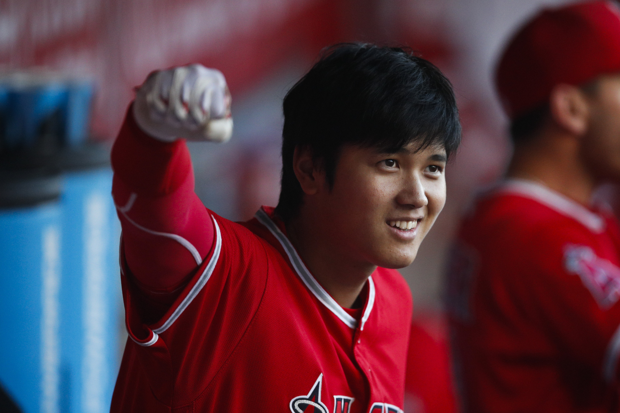 Shohei Ohtani gestures from the dugout during the first inning of the Angels' game against the Astros on Tuesday in Anaheim, California. | AP