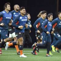 The Brave Blossoms run during a morning practice on Nov. 25, 2017, ahead of a match against France in Paris. | KYODO