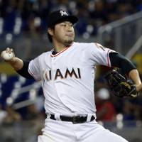 Miami\'s Junichi Tazawa pitches during the Marlins\' game against the Dodgers on May 17. | AP