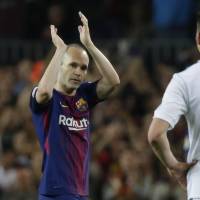 Barcelona\'s Andres Iniesta leaves the pitch during his club\'s match against Real Madrid on Sunday in Barcelona. | AP