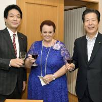 Israeli Ambassador Yaffa Ben-Ari (center) welcomes State Minister for Foreign Affairs Kentaro Sonoura (left), and Komeito chief Natsuo Yamaguchi during a reception to celebrate the 70th anniversary of Israel\'s independence at the Israeli ambassador\'s residence on May 14. | YOSHIAKI MIURA